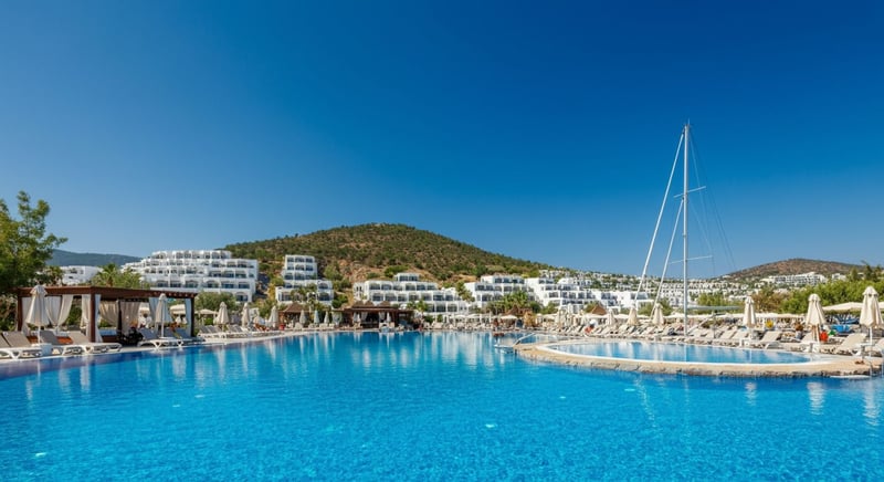 Family enjoying a poolside view at a top hotel in Bodrum