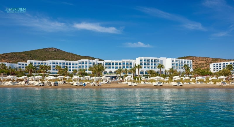 Family enjoying sunny day at Bodrum hotel pool