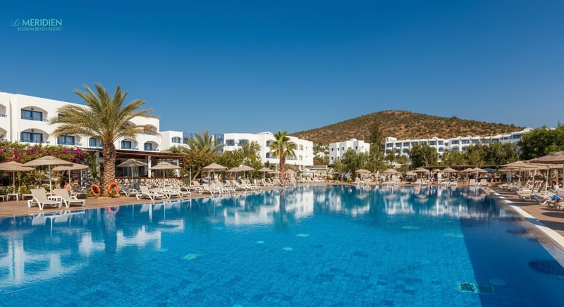 Family enjoying sunny day at Bodrum hotel pool