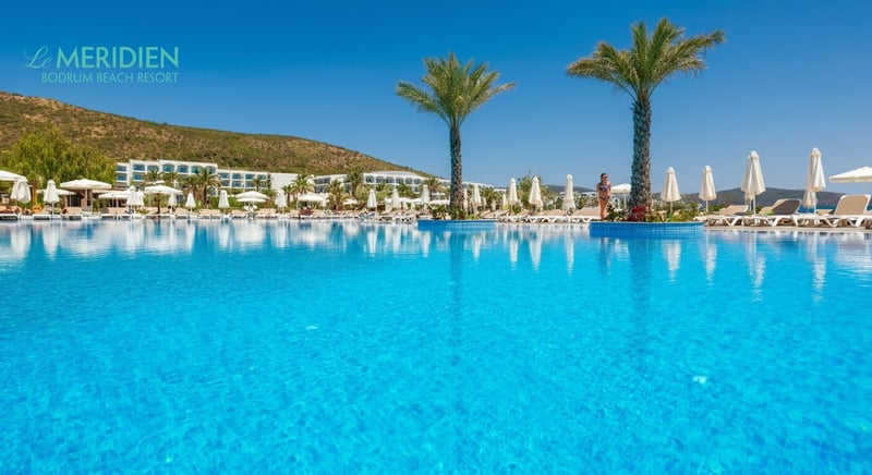 Family enjoying sunny day at Bodrum hotel pool
