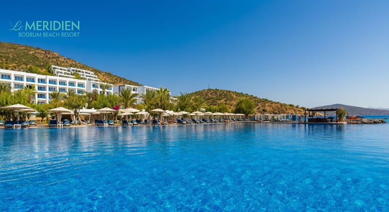 Family enjoying vacation at Bodrum hotel pool